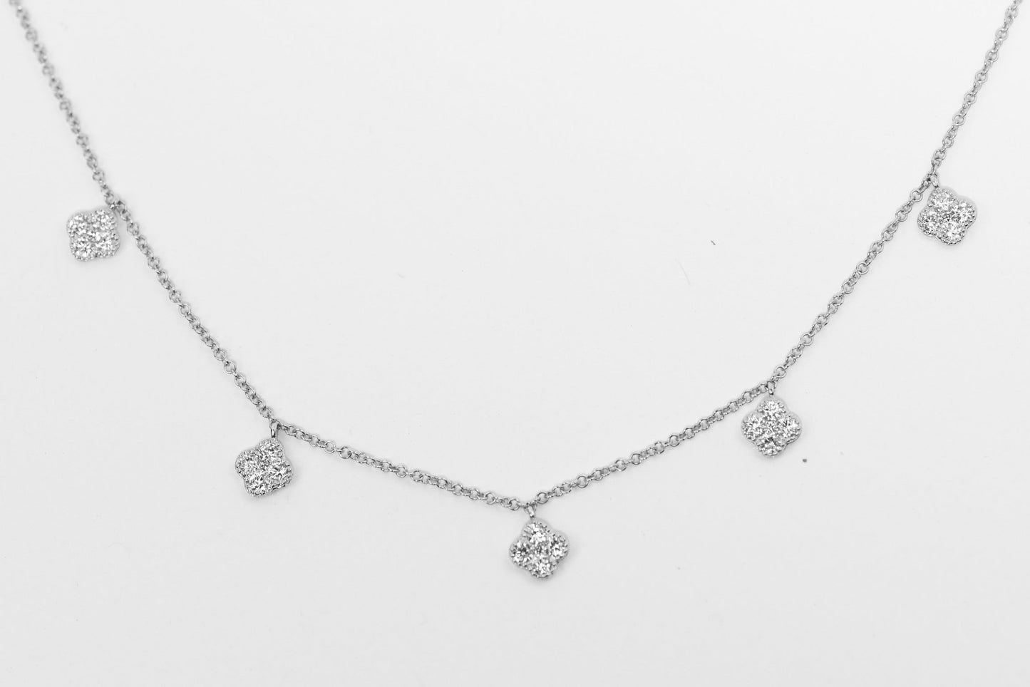 Dangle neckless with 5 diamond flowers