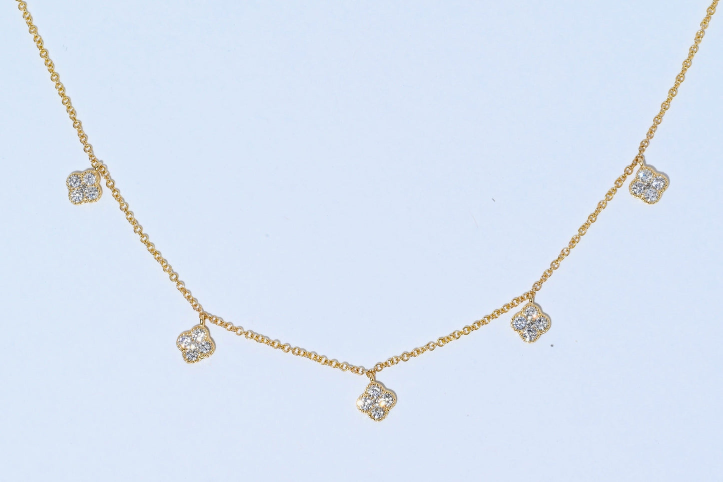 Dangle neckless with 5 diamond flowers