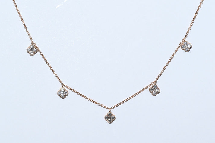 Dangle neckless with 5 diamond flowers