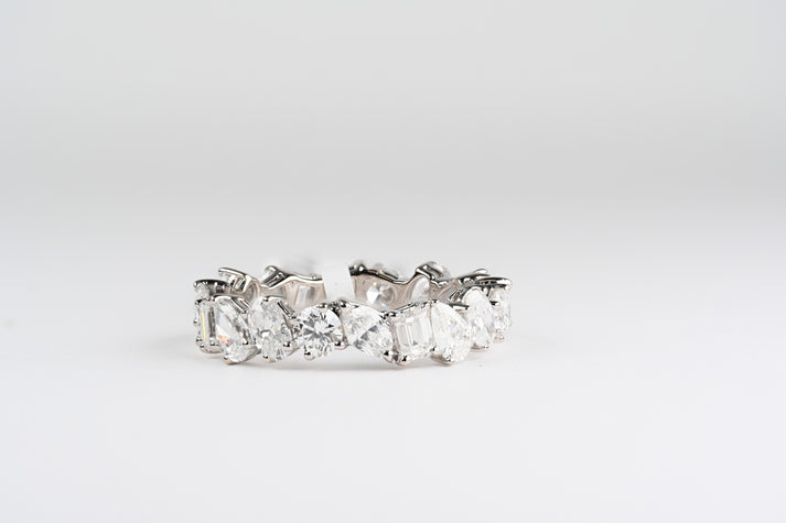 18Kw multiple shape diamond eternity ring