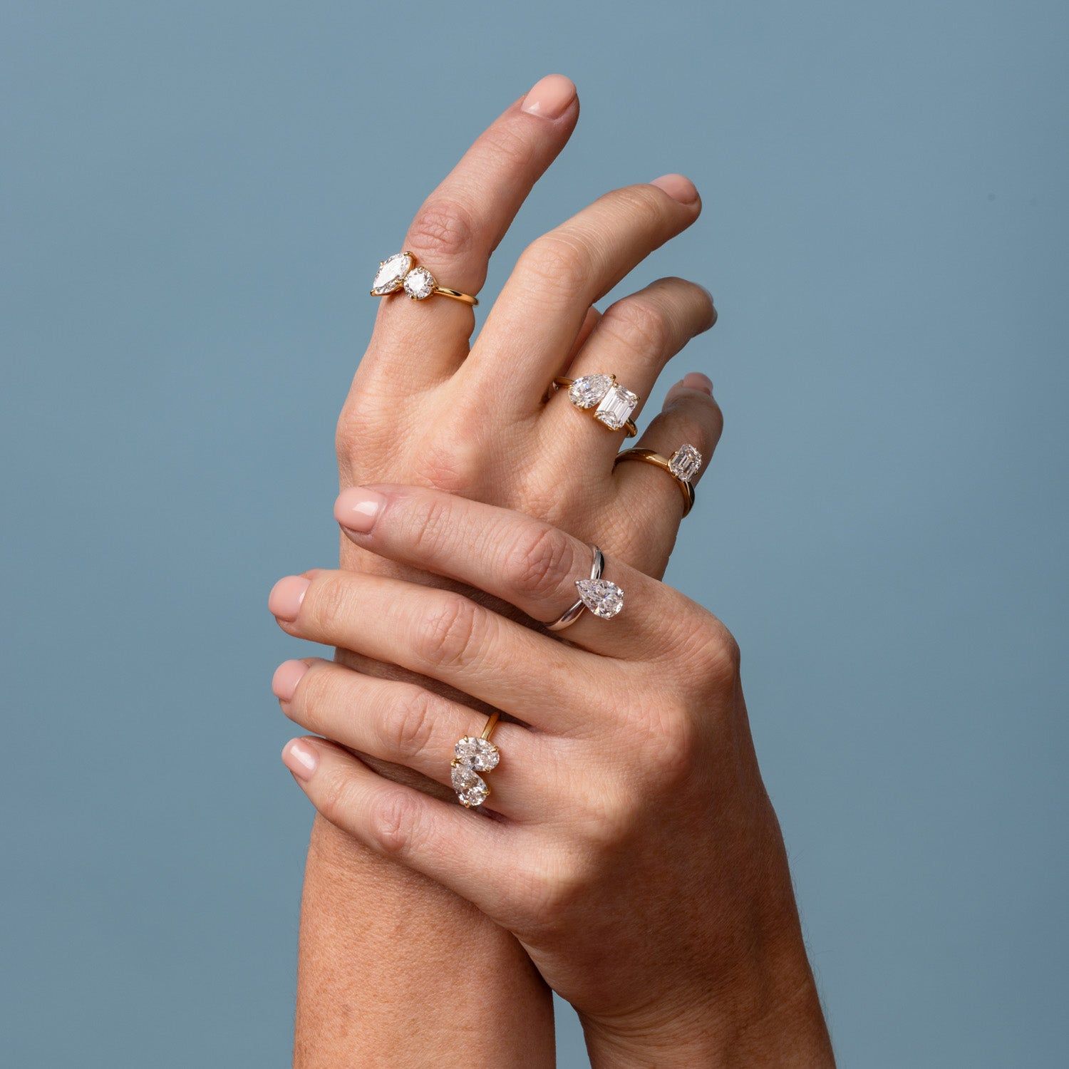 Clarity Diamond™ On Model Round and Emerald Toi et Moi Ring