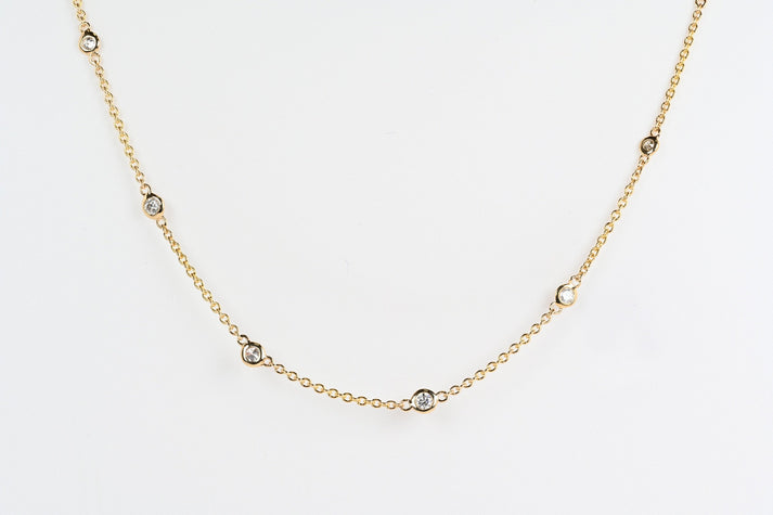 Nine shiny diamonds bezel set on a fine gold chain